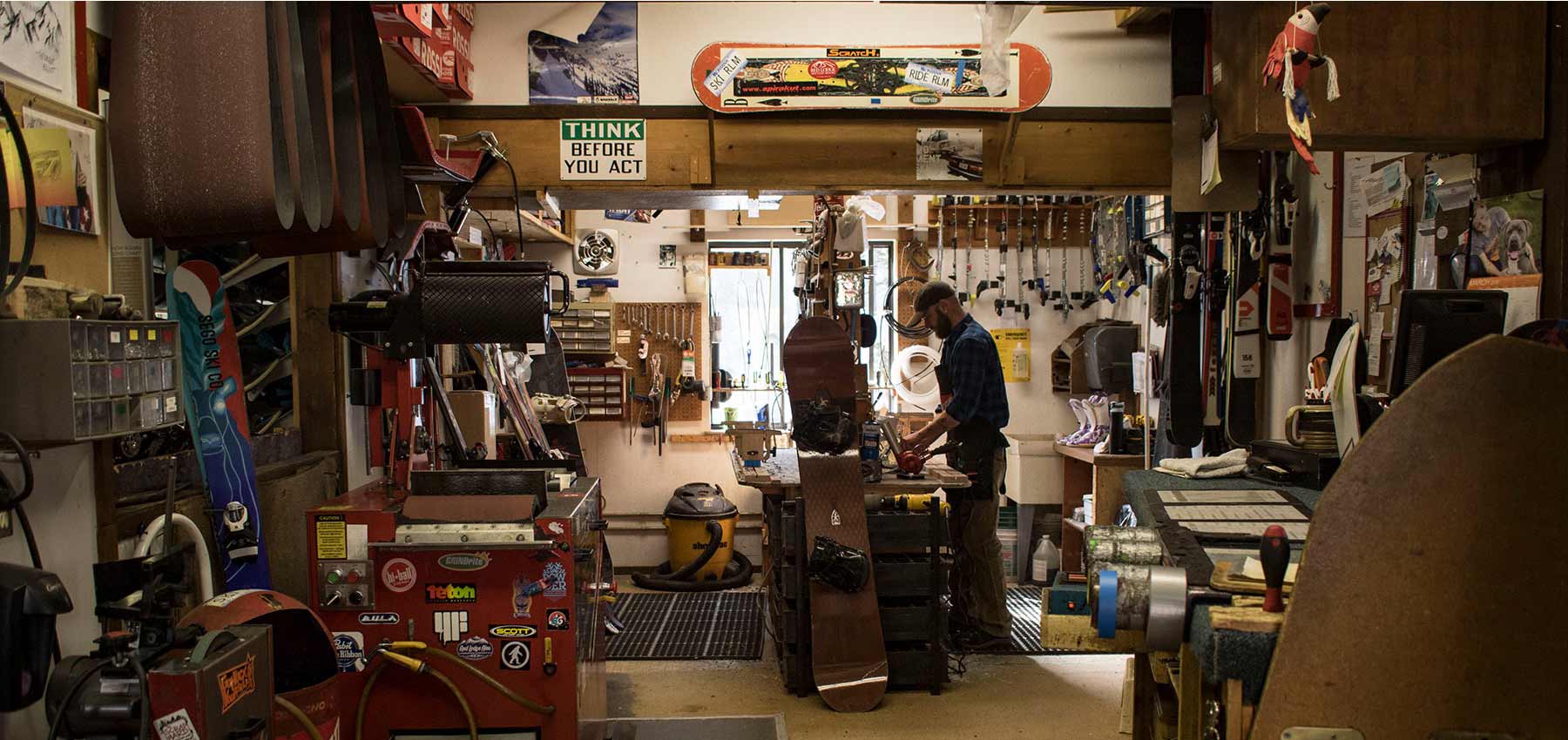 repair shop employee tuning skis