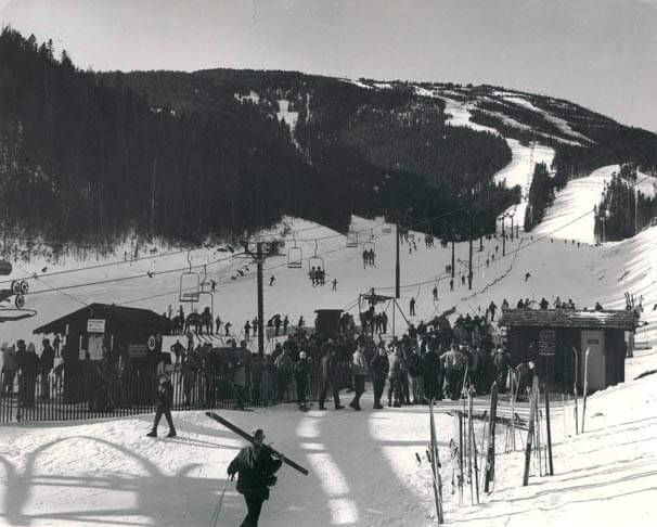 https://www.redlodgemountain.com/wp-content/uploads/historic.img-skiers-at-the-base-of-the-chair-red-lodge-mountain-montana-ski-area.jpg